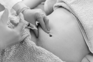 Injection treatment on abdominal area - weight loss and medical aesthetic procedure