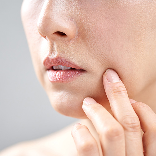Woman experiencing a painless face lifting treatment