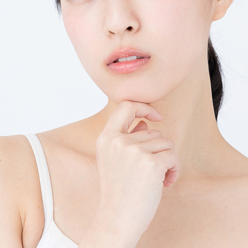 Close-up of a person lightly touching their chin to demonstrate desire for minimal discomfort and fast results.