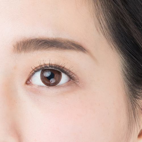 Close-up of semi-permanent eyebrow tattoo, focusing on natural look and eyebrow microblading.