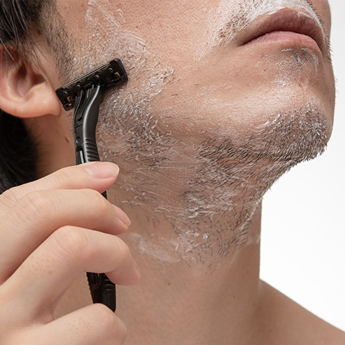 Man Shaving Face with Razor for Smooth Skin - Semi-Permanent and Safe Hair Removal