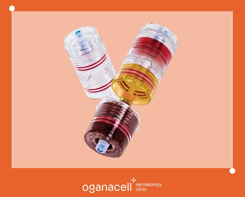「Oganacellの最新幹細胞治療製品が並んでいる写真。3つのカラフルな容器が重なり合っています。」