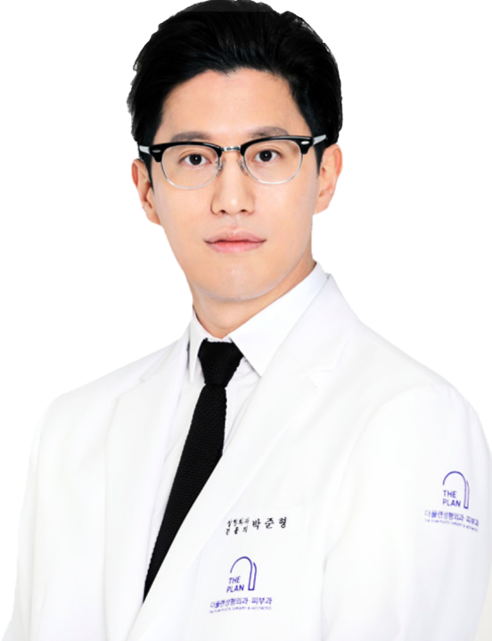Dr. Jun Hyung Park wearing white medical coat and glasses