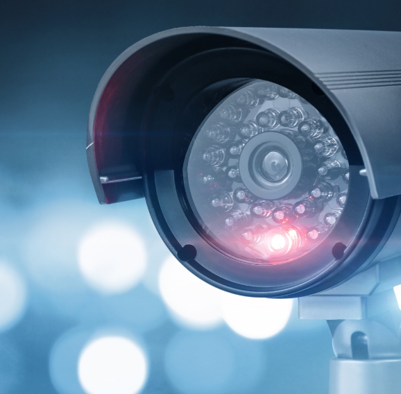 Close-up of a security camera with infrared light in operation