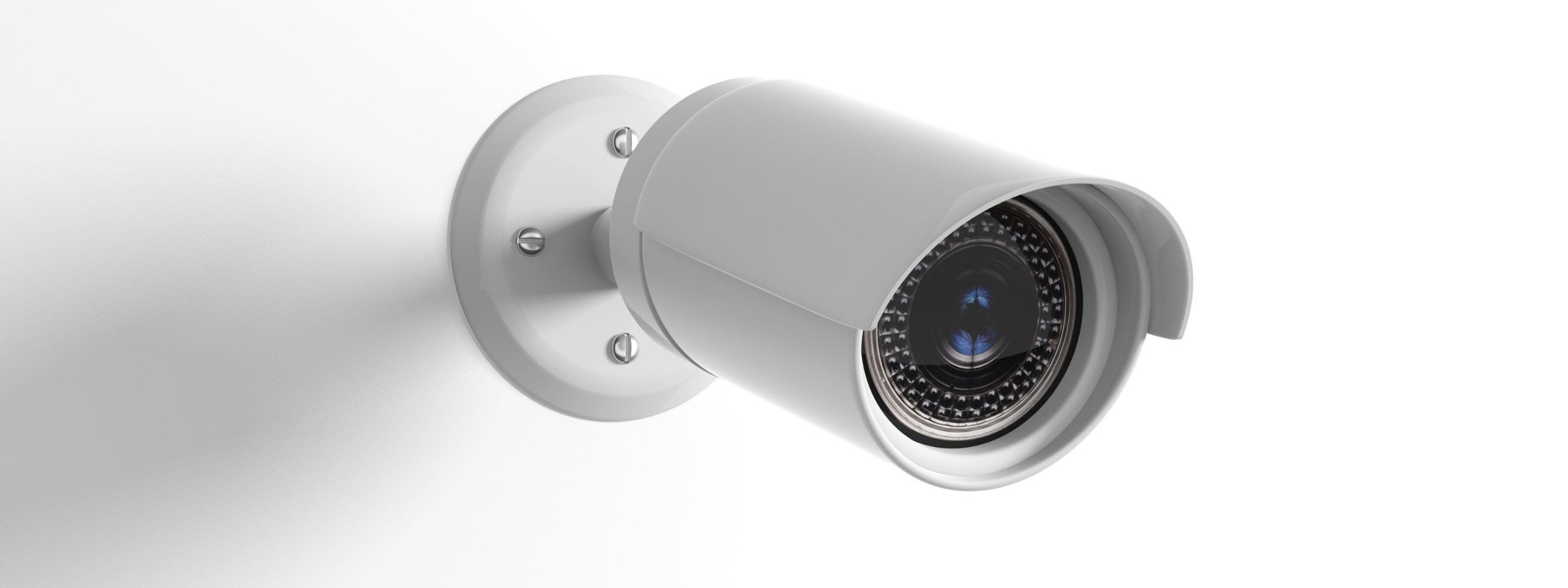 Security camera with night vision mounted on white wall